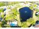 Aerial view featuring a pool, well-maintained landscaping, and a tranquil pond at 10131 Lake Oak Cir, Tampa, FL 33624