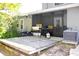 Backyard featuring a wooden deck and an outdoor grill at 10131 Lake Oak Cir, Tampa, FL 33624