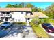 Charming two-story townhouse with a well-manicured lawn and convenient parking spaces at 10131 Lake Oak Cir, Tampa, FL 33624