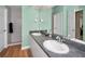 Bright bathroom with dual sinks, and a walk-in shower at 1028 Rosetree Ln, Tarpon Springs, FL 34689