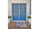 Inviting front door with pots, showcasing curb appeal and welcoming entrance at 1028 Rosetree Ln, Tarpon Springs, FL 34689