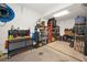 Garage with a variety of shelving, tools, work bench and tool storage for home projects at 1028 Rosetree Ln, Tarpon Springs, FL 34689