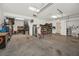 Spacious two car garage offering ample storage, work space, and door to the backyard at 1028 Rosetree Ln, Tarpon Springs, FL 34689