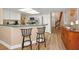 Eat-in kitchen featuring modern appliances, countertops, and wooden cabinets at 1028 Rosetree Ln, Tarpon Springs, FL 34689