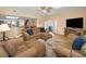 Inviting living room features hardwood floors, neutral decor, and backyard access at 1028 Rosetree Ln, Tarpon Springs, FL 34689