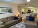 Inviting living room with seamless flow into a well-equipped kitchen and adjacent rooms at 1028 Rosetree Ln, Tarpon Springs, FL 34689