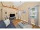 Inviting living room with comfortable seating, entertainment center, and natural light at 1028 Rosetree Ln, Tarpon Springs, FL 34689