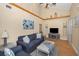 Bright living room featuring vaulted ceilings, wooden beams, and stylish decor accents at 1028 Rosetree Ln, Tarpon Springs, FL 34689