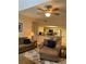 View of living room leading into kitchen with modern appliances and bar seating at 1028 Rosetree Ln, Tarpon Springs, FL 34689