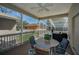 Screened patio with outdoor dining furniture and relaxing view at 1028 Rosetree Ln, Tarpon Springs, FL 34689
