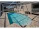Sparkling private pool with enclosed screen, perfect for relaxation and recreation at 1028 Rosetree Ln, Tarpon Springs, FL 34689