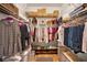 Organized walk-in closet with shelving and hanging space at 1028 Rosetree Ln, Tarpon Springs, FL 34689