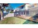 Screened patio extends into the fenced backyard, offering a perfect outdoor living space at 10488 Saint Tropez Pl, Tampa, FL 33615
