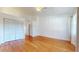 Bright bedroom features hardwood flooring, a ceiling fan and a spacious closet at 10488 Saint Tropez Pl, Tampa, FL 33615