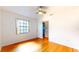 This bedroom boasts natural light, hardwood floors, and a ceiling fan at 10488 Saint Tropez Pl, Tampa, FL 33615