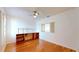 Bedroom featuring hardwood floors, closet, built-in desk, and window at 10488 Saint Tropez Pl, Tampa, FL 33615