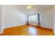 Bright bedroom with hardwood floors and a large window at 10488 Saint Tropez Pl, Tampa, FL 33615