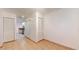 Hallway area with tiled flooring, closet doors, and views of the kitchen at 10488 Saint Tropez Pl, Tampa, FL 33615