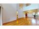 Sun-drenched living area featuring gleaming hardwood floors and soaring ceilings at 10488 Saint Tropez Pl, Tampa, FL 33615