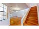 Bright living room with hardwood floors and a large window at 10488 Saint Tropez Pl, Tampa, FL 33615