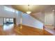 Open floorplan featuring wood floors and natural light from sliding glass door at 10488 Saint Tropez Pl, Tampa, FL 33615