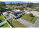 Aerial view of the property, showcasing the home, yard, and surrounding neighborhood at 1054 W Baffin Dr, Venice, FL 34293