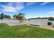 Beautiful backyard featuring an in-ground pool, patio, grassy area, and a privacy fence at 1054 W Baffin Dr, Venice, FL 34293