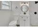 Bathroom featuring a toilet, vanity, and tiled shower with modern finishes at 1054 W Baffin Dr, Venice, FL 34293