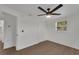 Bedroom features new flooring, modern ceiling fan, natural light, and closet space at 1054 W Baffin Dr, Venice, FL 34293