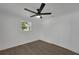 Bright bedroom features new floors, ceiling fan, and natural light from a window at 1054 W Baffin Dr, Venice, FL 34293