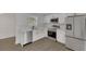 Modern kitchen featuring stainless steel appliances, white cabinets, and quartz countertops at 1054 W Baffin Dr, Venice, FL 34293