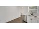 Bright kitchen area showcasing stainless steel dishwasher, white shaker cabinets and white subway tile at 1054 W Baffin Dr, Venice, FL 34293