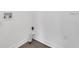 Clean, functional laundry room with washer/dryer hookups and modern gray wood-look flooring at 1054 W Baffin Dr, Venice, FL 34293