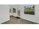 Bright living area with hardwood floors and lots of natural light, perfect for relaxing at 1054 W Baffin Dr, Venice, FL 34293
