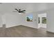 Light-filled living room with hardwood floors, recessed lighting, and a ceiling fan at 1054 W Baffin Dr, Venice, FL 34293
