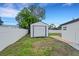 Image of a backyard with a shed and a white fence providing privacy and security at 1054 W Baffin Dr, Venice, FL 34293