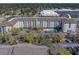 Stunning aerial view of the community showcasing building architecture, parking, landscaping, and recreational amenities at 1216 S Missouri Ave # 225, Clearwater, FL 33756