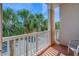 Enjoy picturesque views of lush palm trees from this inviting balcony, perfect for relaxation and outdoor living at 1216 S Missouri Ave # 225, Clearwater, FL 33756