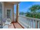 Relaxing balcony with a white chair, offering a serene outdoor space to enjoy the fresh air and neighborhood views at 1216 S Missouri Ave # 225, Clearwater, FL 33756