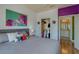 Cozy bedroom features stylish decor, a comfortable bed, and an open closet for easy storage and organization at 1216 S Missouri Ave # 225, Clearwater, FL 33756