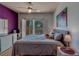 Inviting bedroom with a comfortable bed, private balcony access, and stylish decor at 1216 S Missouri Ave # 225, Clearwater, FL 33756