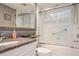 Modern bathroom featuring granite counters and a shower-tub combo at 1400 Water View W Dr # 102, Largo, FL 33771