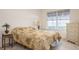 Bright bedroom with a large window and neutral decor at 1400 Water View W Dr # 102, Largo, FL 33771