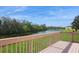 Private wooden deck with scenic views of the lake, providing a peaceful space for outdoor relaxation at 1400 Water View W Dr # 102, Largo, FL 33771