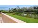 Expansive deck overlooking a serene lake and manicured golf course, perfect for enjoying outdoor living at 1400 Water View W Dr # 102, Largo, FL 33771