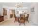 Inviting dining room area complemented by a view to the charming kitchen at 1400 Water View W Dr # 102, Largo, FL 33771