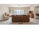Comfortable living room with large windows and plush seating, ideal for relaxing and entertaining guests at 1400 Water View W Dr # 102, Largo, FL 33771