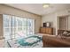 Inviting living room with a sliding door and views of the lanai, complete with stylish furnishings at 1400 Water View W Dr # 102, Largo, FL 33771
