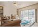 Bright and airy living room with a cozy sitting area and screened in lanai access, perfect for relaxing at 1400 Water View W Dr # 102, Largo, FL 33771