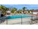 Enjoy this beautiful community pool and patio surrounded by mature trees at 1400 Water View W Dr # 102, Largo, FL 33771
